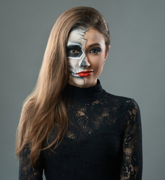 woman with makeup skeleton grins