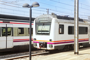 Fototapeta premium Suburban railway train at the railways stantion.