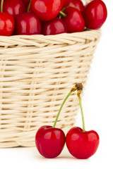 Close up to a red cherries in a basket