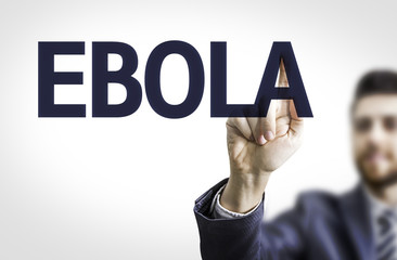 Business man pointing to transparent board with text: Ebola