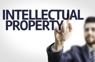 Business man pointing the text: Intellectual Property