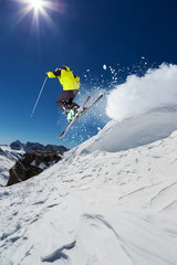 Fototapeta na wymiar Alpine skier jumping from hill