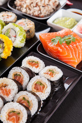 Sushi pieces on black stone