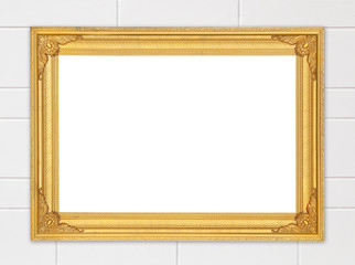 blank golden frame on cement wall
