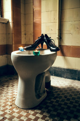 High heels on a toilet
