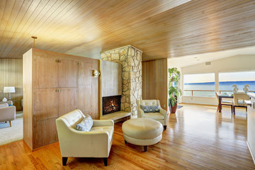 Beautiful house interior with wooden plank trim. Cozy sitting ar