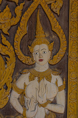 Thai carve on wooden board door style , in the temple at Norther