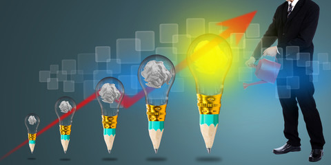 Businessman hold red watering pot for give his growing idea