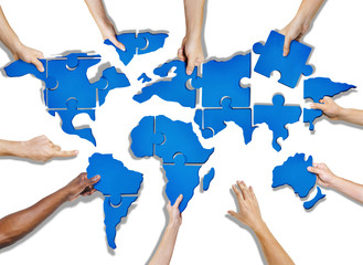 Hands Holding Jigsaw Puzzle Forming World