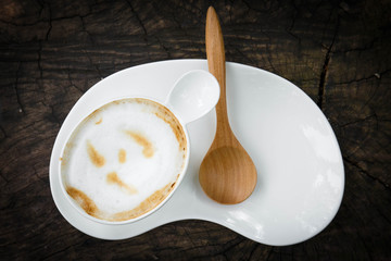 cup of coffee with wood spoon