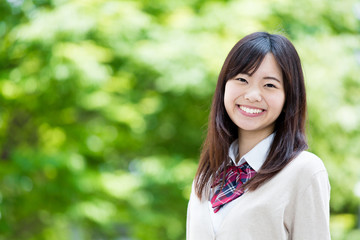 portrait of young asian student in the park