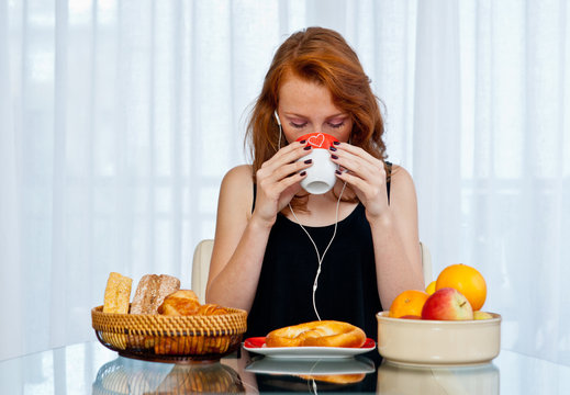 Attractive Girl With Freckles Drinking From Cup