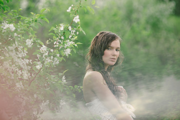 Fototapeta premium the girl with a bouquet of wild flowers in cloudy weather 2
