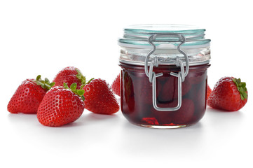 Strawberry jam and berries isolated on white.