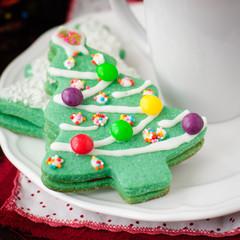 Christmas Tree Cookies on a White Plate with a Cup of Coffee