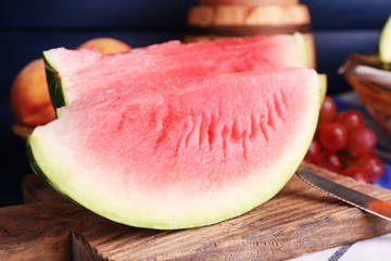 Composition of ripe watermelon, fruits, pink wine in glass and