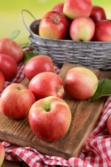 Sweet apples  on table on bright background