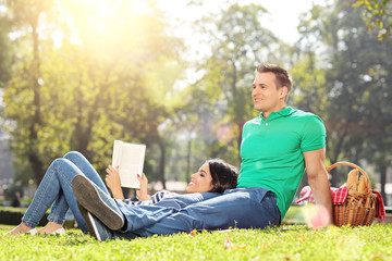 Fototapeta premium Boyfriend and girlfriend relaxing in park