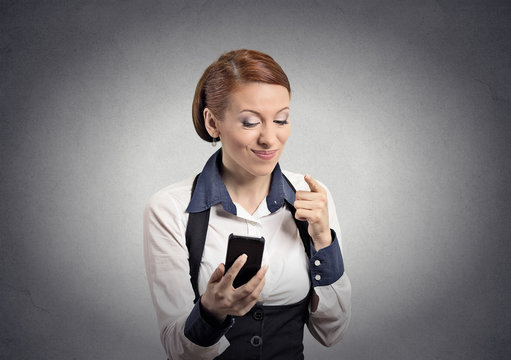 angry woman pointing with finger at smart phone