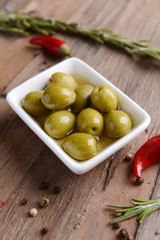 Marinated olives on table close-up