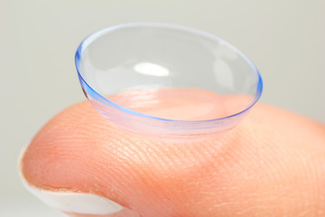 Contact lens on finger, close-up