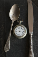 Vintage spoon, knife and pocket watches.