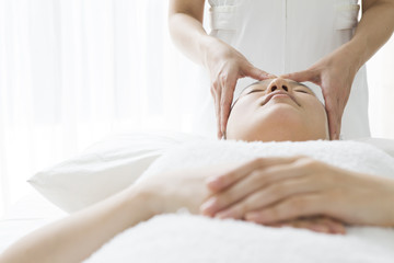 Women undergoing facial massage
