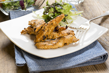 Grilled chicken strips with side salad