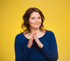 sly, scheming woman isolated on yellow background 