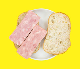 Processed ham sandwich on small plate