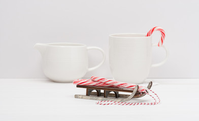 Christmas Candy Cane On Wooden Sledge. White Painted Wood Backgr