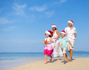 Family Having Fun on the Beach on Christmas