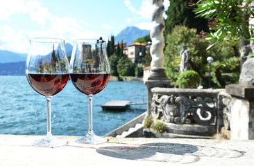Two wineglasses. Varenna town at the lake Como, Italy
