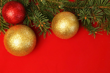 Golden and red balls on red background