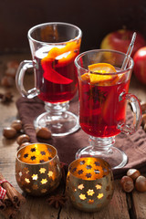 glass of mulled wine with orange and spices, christmas decoratio