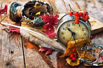 rainy autumn weather,the old clock,fallen leaves