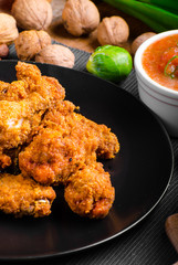 Spicy breaded chicken wings with homemade bread