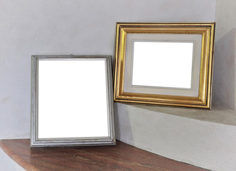 Blank picture frame on white wall