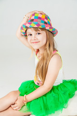 Little fashion girl in beautiful dress posing