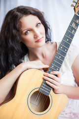 hippie girl with the guitar on white