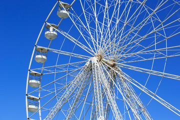 Ferris wheel isolated against blue