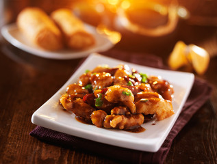 chinese general tso's chicken with fortune cookie and egg rolls