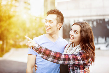Young couple pointing