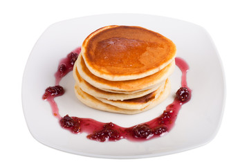 pancakes with raspberry jam on a white plate isolated on white b