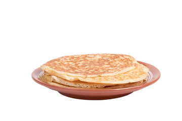 Russian traditional yeast crepes lying in the ceramic dish. Shal