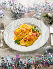 fish fillet with saffron and orange on christmas table