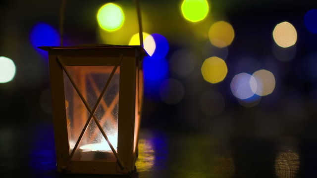 Outdoor lantern with lit candle