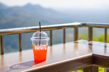 Lemonade iced glass with stray on table in top hill restaurant i