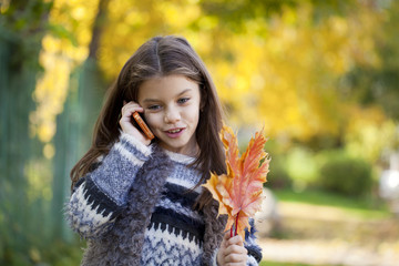 School girl calling by phone