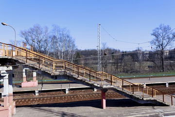 Fototapeta premium Passage of the stairs to the train platform